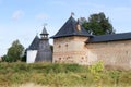The tops of the fortress wall towers of Pskov-Pechory Dormition Monastery in Pechory, Pskov region, Russia under blue sky Royalty Free Stock Photo