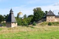 The tops of the fortress wall towers of Pskov-Pechory Dormition Monastery in Pechory, Pskov region, Russia under blue sky Royalty Free Stock Photo