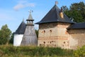 The tops of the fortress wall towers of Pskov-Pechory Dormition Monastery in Pechory, Pskov region, Russia under blue sky Royalty Free Stock Photo