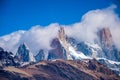 The tops of the rocky mountains are immersed in clouds. Shevelev.