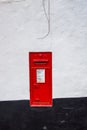 A Victorian post box embedded in a common wall in Topsham Devon. Royalty Free Stock Photo