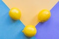 Topv view of three lemons on colorful pastel background Royalty Free Stock Photo