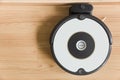 Topview Auto robot vacuum, park at dock battery charge station with wooden space for text Royalty Free Stock Photo