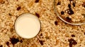 Topview of bowl of muesli with milk. Healthy breakfast concept with oat on oat flakes background