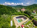 Topview from a drone over the pool surrounded by green trees Royalty Free Stock Photo