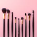 Topview makeup brushes set on a pink backdrop