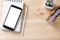 Topview of office stuff on wooden working table. Royalty Free Stock Photo