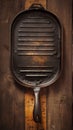 Topview of an old grill pan, empty, on rustic oak