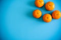 Topview of orange with desktop on plates blue background. topview or flat lay fruit.