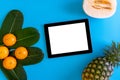 Topview of orange,pineapple, cantaloupe with desktop with blank