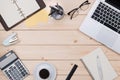 Topview of wooden desk with office tools and plant Royalty Free Stock Photo