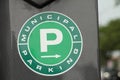 tor, canada - July 1, 2023: green p municipal parking pay meter with blurred road in background, green-. Royalty Free Stock Photo