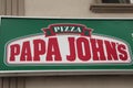 tor, canada - July 1, 2023: pizza papa johns rectangle sign, red caption on white and green background-.