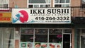 Tor, Canada - July 1, 2023: small independent sushi restaurant Ikki sushi Japanese cuisine storefront,