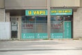 tor, canada - July 26, 2023: u vape store open 7 days a week, yellow and green with windows and neon open