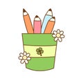 Illustrated pencil holder with a green and yellow striped design, featuring a clover in the center. Royalty Free Stock Photo