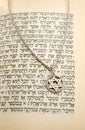 The Torah and silver chain with magen david Royalty Free Stock Photo