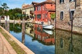 Torcello, Venice. Colorful houses on Torcello island, canal and boats. Summer, Italy Royalty Free Stock Photo