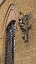 Torch stand with dragon as a city symbol, a detail from medieval building in Voltera, Tuscany Royalty Free Stock Photo