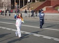Torchbearer carries the Olympic flame.