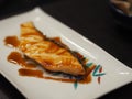 Torched Salmon Aburi Saikyo Sushi with sweet sauce on white plate, Japanese food