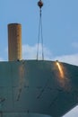 Torches and workers take a part the old water tower on a sunny day in Ann Arbor, Michigan Royalty Free Stock Photo