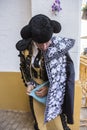 Toreador putting itself the walk cape in the alley before going out to fight, typical and very ancient tradition in Linares, Jaen