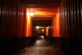 Tori gates in Fushimi Inari Shrine at night with selective focus , Kyoto, Japan Royalty Free Stock Photo