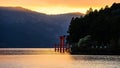 torii gate at Lake Ashi during sunset Royalty Free Stock Photo