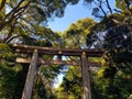 Torii Gate standing at the entrance to Meiji Jingu Shrine iat Harajuku Urban Forest, Tokyo Royalty Free Stock Photo