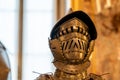 Close-up on golden iron helmet composing a medieval armour Royalty Free Stock Photo
