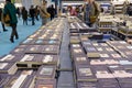 Desk with a lot of newly published books in the thirty-third edition of the international book fair.