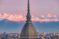 Torino Turin, Italy: cityscape at sunrise with details of the Mole Antonelliana towering over the city. Scenic colorful light on Royalty Free Stock Photo