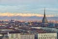 Torino Turin, Italy: cityscape at sunrise with details of the Mole Antonelliana towering over the city. Scenic colorful light on Royalty Free Stock Photo