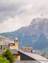 Torla Ordesa, church with the mountains at bottom, Pyrenees Spain vertical Royalty Free Stock Photo