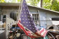 Torn American flag in junkyard