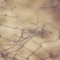 Torn barbed wire fence closeup, selective focus Royalty Free Stock Photo