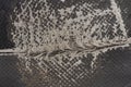 Torn black fabric on a leather office armchair background texture. worn upholstery chair Royalty Free Stock Photo