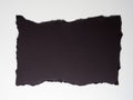torn black paper isolated over white background Royalty Free Stock Photo