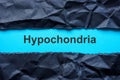 Torn black paper and word hypochondria. Royalty Free Stock Photo