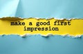 Torn blue paper bright yellow background. Black text says make good first impression. Visual represents new beginnings, Royalty Free Stock Photo