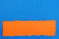 Torn blue paper strip orange background border frame Royalty Free Stock Photo