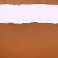 Torn brown paper strip top edge header background frame