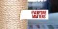 Torn brown paper on white surface with text EVERYONE MATTERs Royalty Free Stock Photo