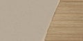 Torn brown texturing paper over a wooden plank wall. Royalty Free Stock Photo