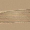 Torn brown texturing paper over a wooden plank wall. Royalty Free Stock Photo