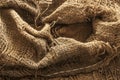 Torn burlap decayed. Ragged linen fabric Royalty Free Stock Photo