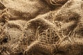 Torn burlap decayed. Ragged linen fabric Royalty Free Stock Photo