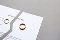 Torn divorce decree on grey background Royalty Free Stock Photo