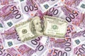 Torn dollars on euro money Royalty Free Stock Photo